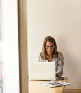 Woman in an office on her laptop